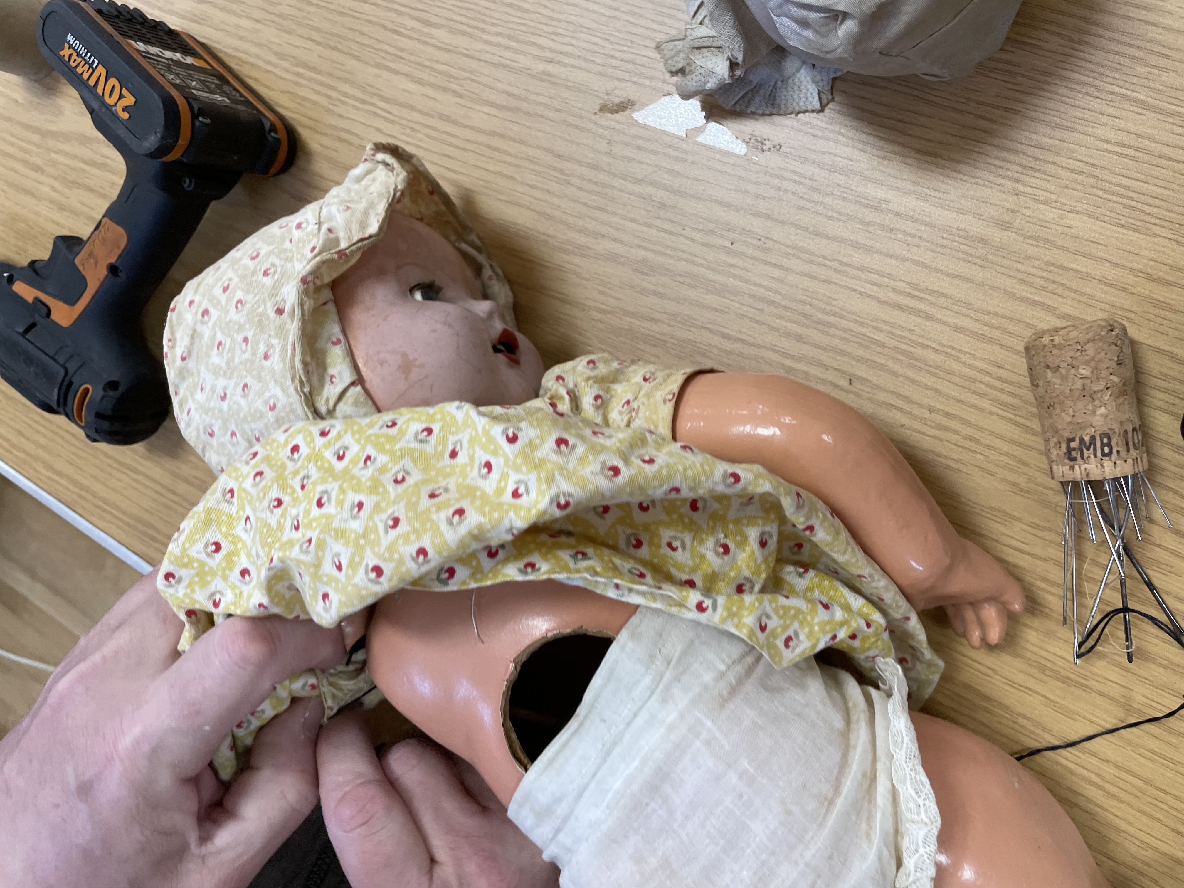 Doll awaiting a new lease on life with limb reattachment