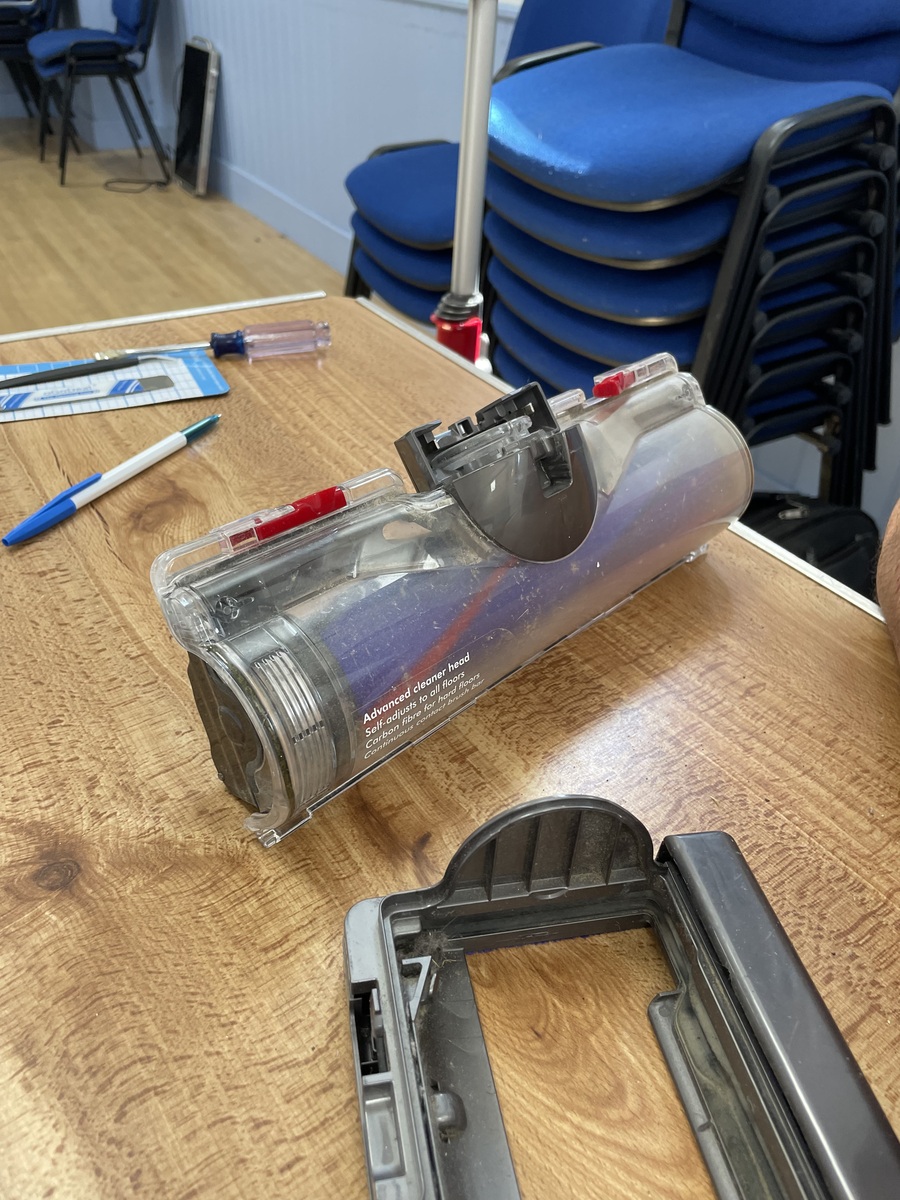 A vacuum cleaner opened for inspection at Tregony Repair Café