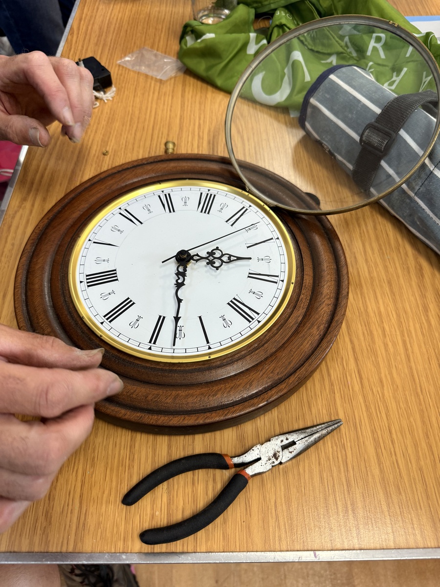 A clock being investigated at Tregony Repair Café