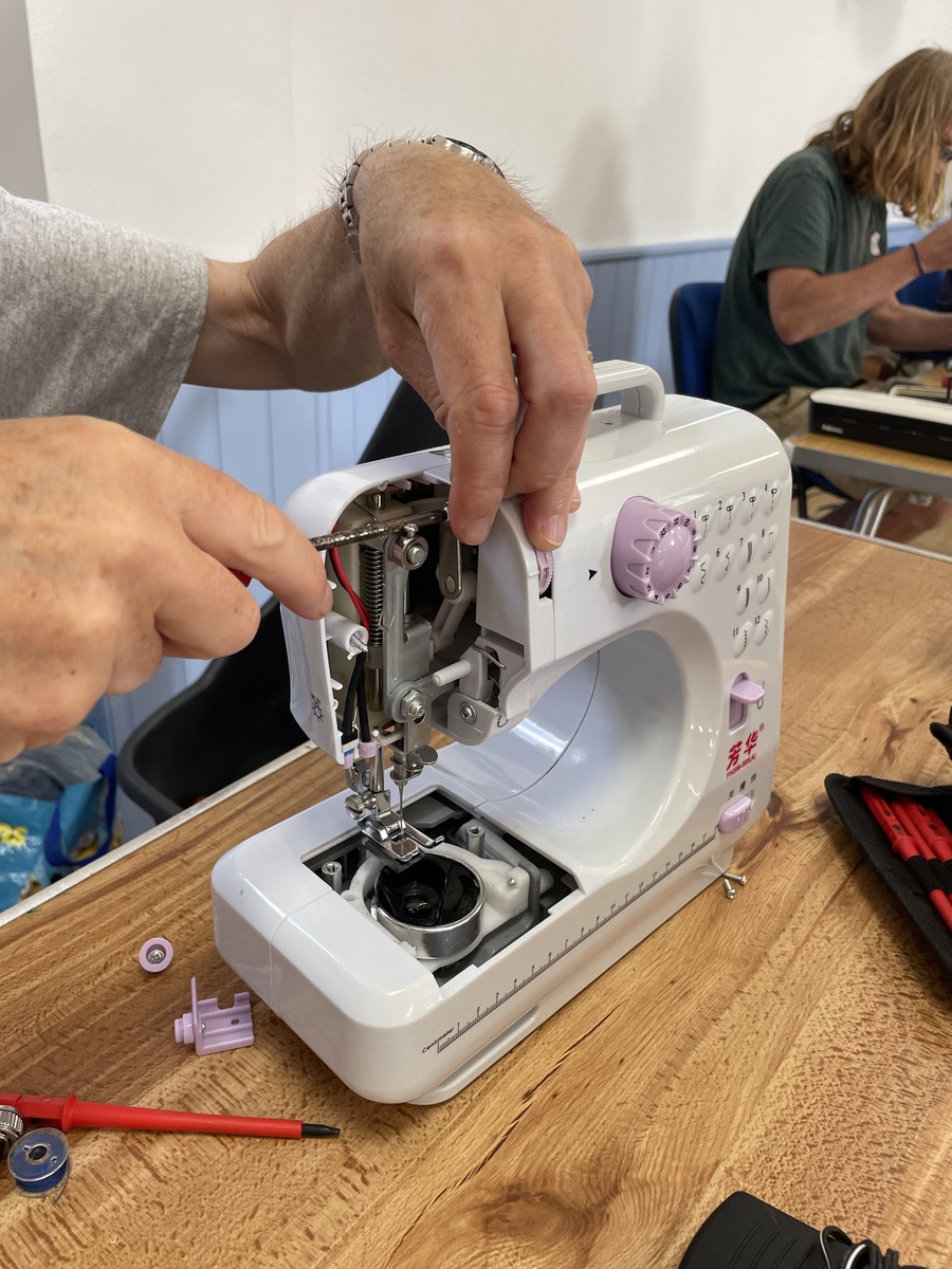 A sewing machine being used for a repair at Tregony Repair Café