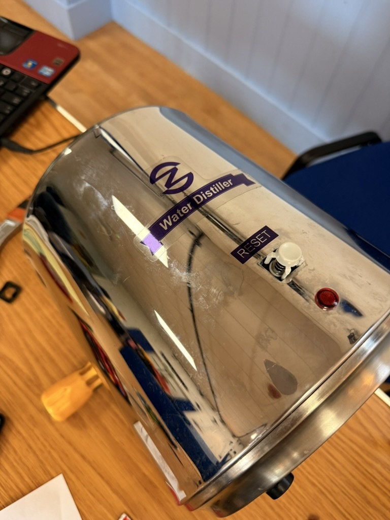 A water distiller on a repair table at Tregony Repair Café